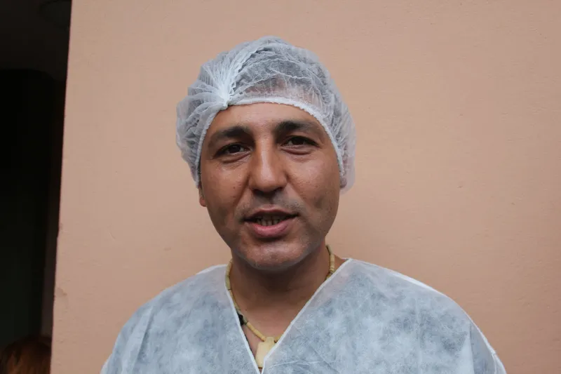 Entering the factory and wearing protective clothing.